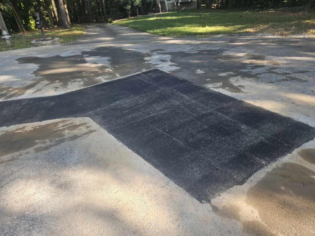 asphalt road patch on Grover Street